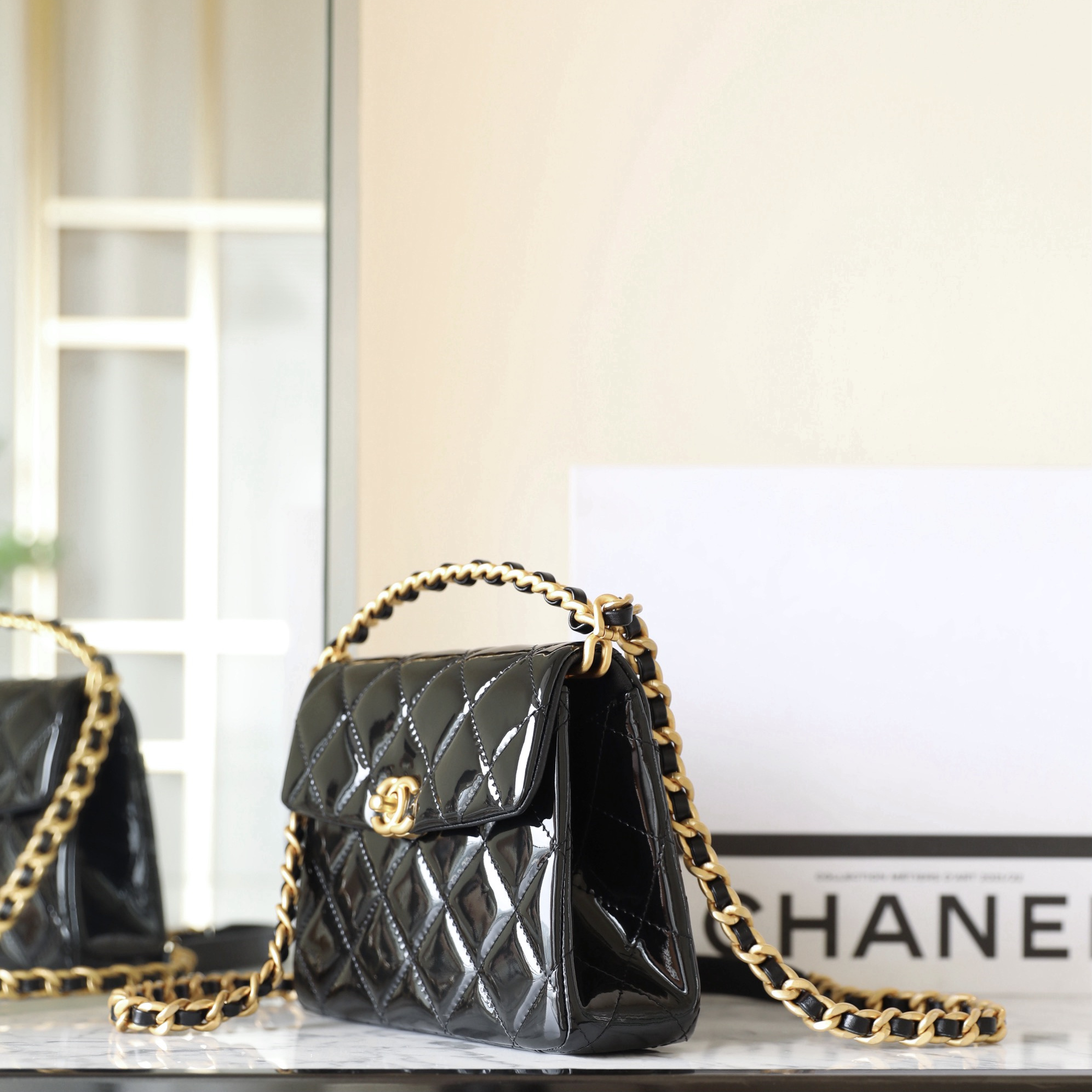 Chanel 24S black patent leather shoulder bag