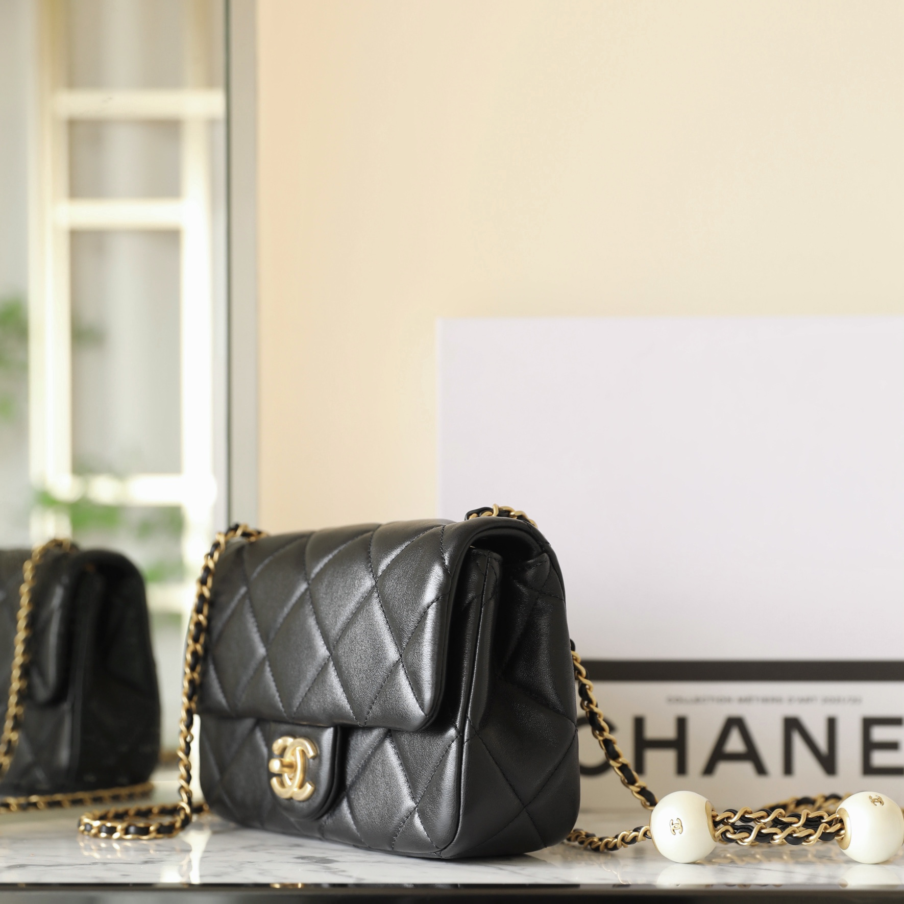 Chanel 24S mini square pearl flap bag black lambskin brushed gold hardware