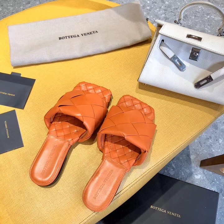 Bottega Veneta Lido Slides In Orange Intreccio Lambskin