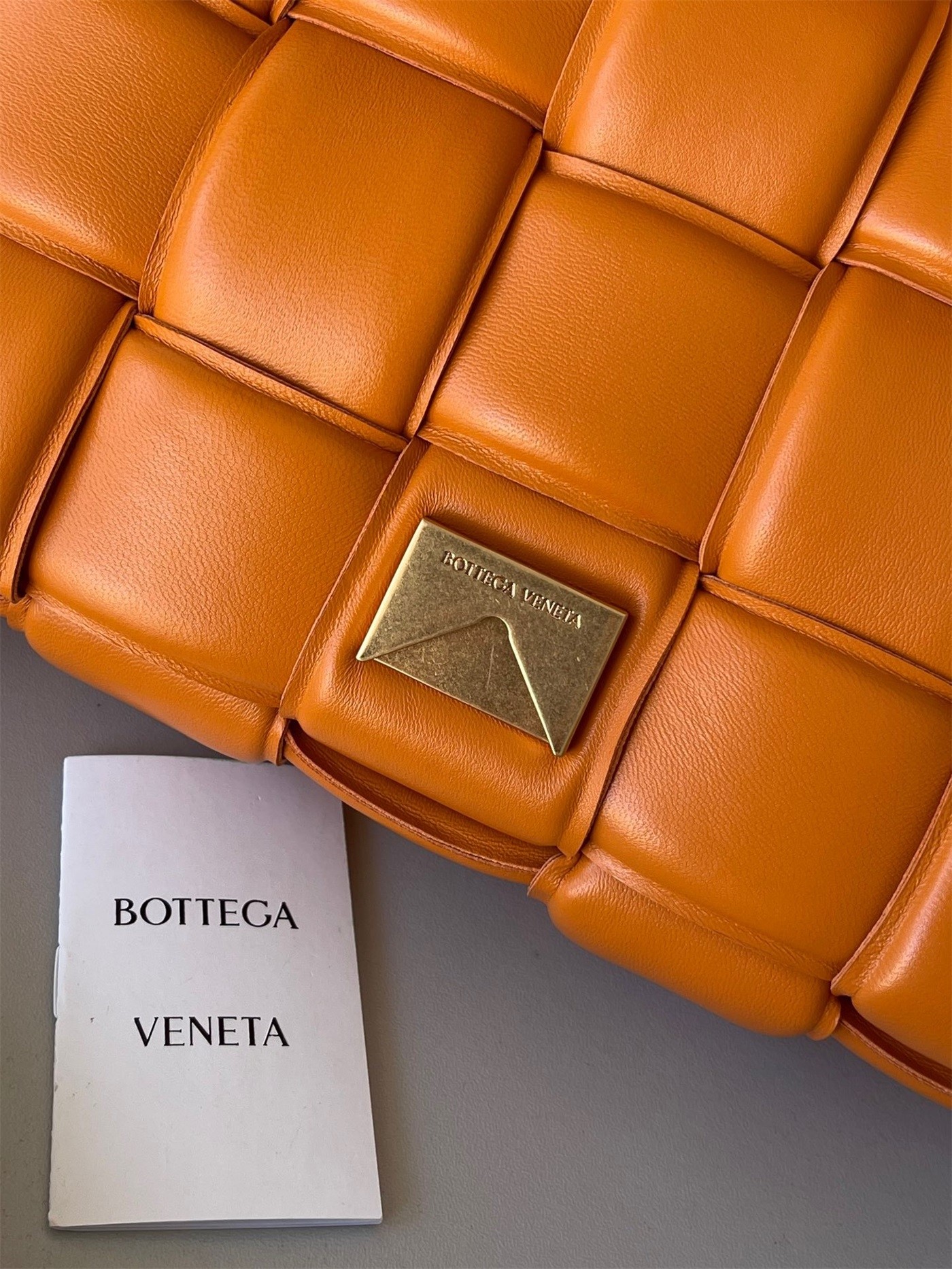 Bottega Veneta Padded Cassette Bag In Orange Lambskin