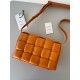 Bottega Veneta Padded Cassette Bag In Orange Lambskin