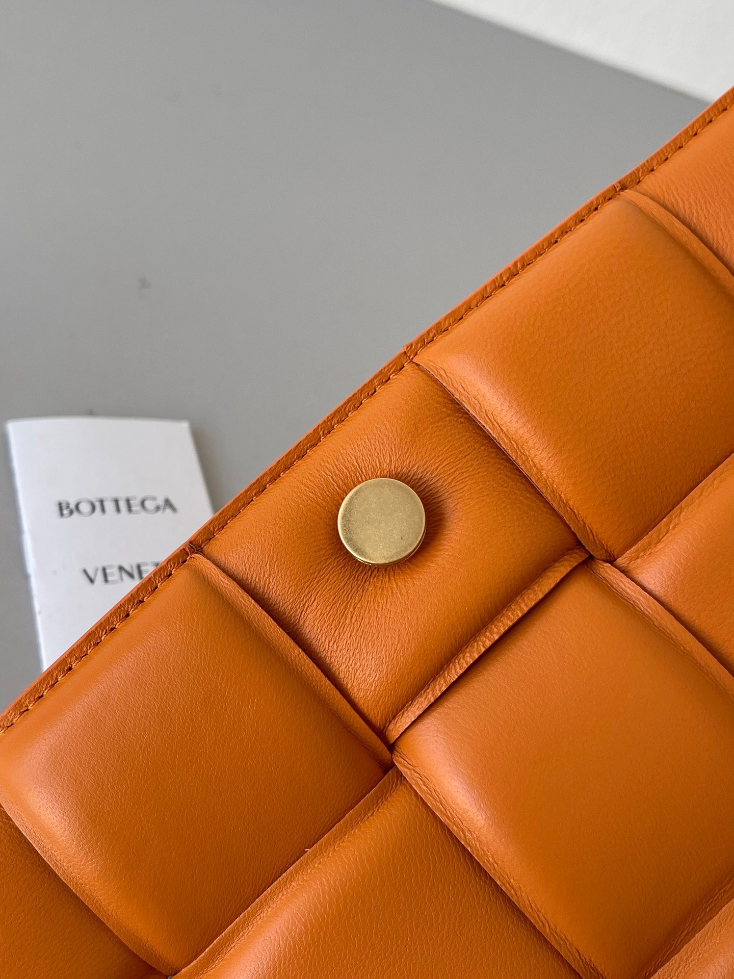 Bottega Veneta Padded Cassette Bag In Orange Lambskin