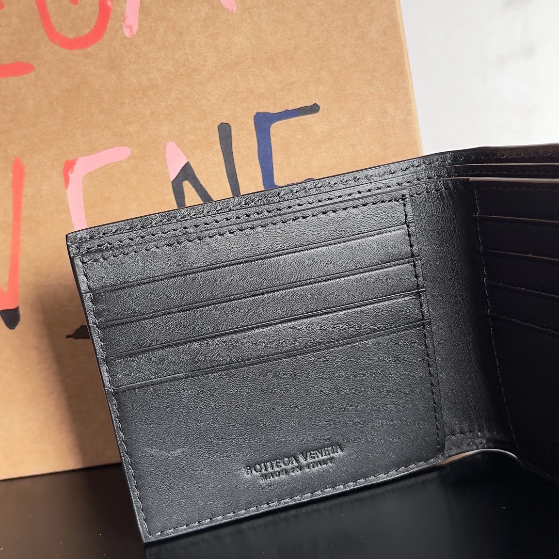 Bottega Veneta Bi-fold Wallet in Black Intrecciato Calfskin