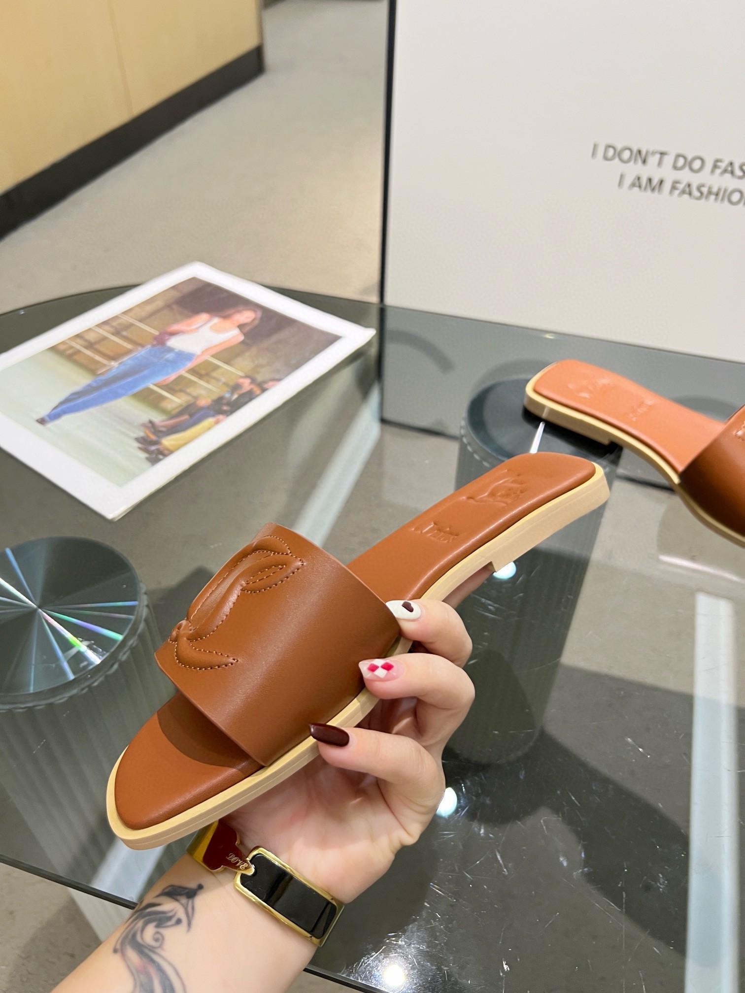 Christian Louboutin CL Mules in Brown Leather