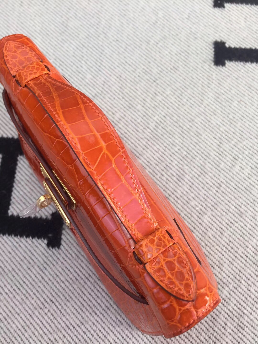 Hermes Orange Kelly Pochette Shiny Niloticus Crocodile Bag