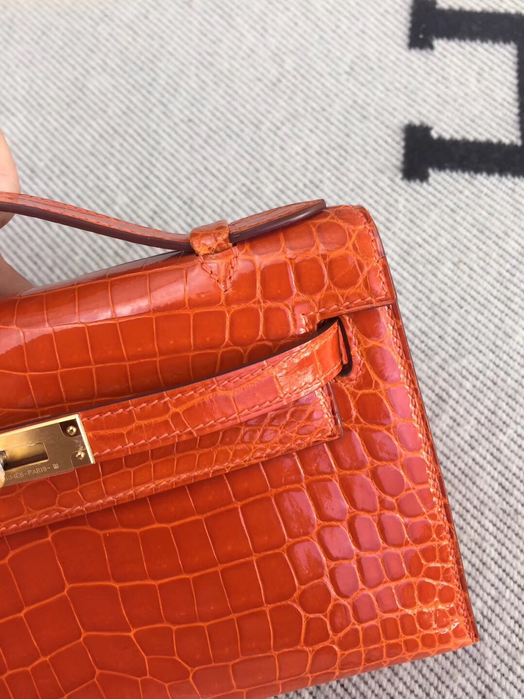 Hermes Orange Kelly Pochette Shiny Niloticus Crocodile Bag