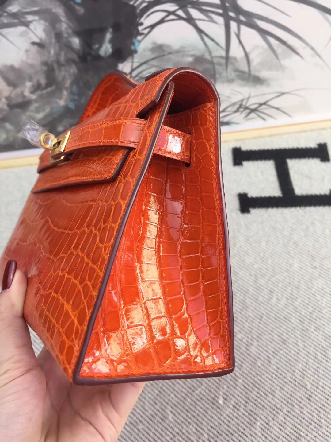 Hermes Orange Kelly Pochette Shiny Niloticus Crocodile Bag