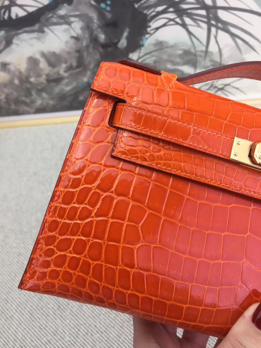 Hermes Orange Kelly Pochette Shiny Niloticus Crocodile Bag