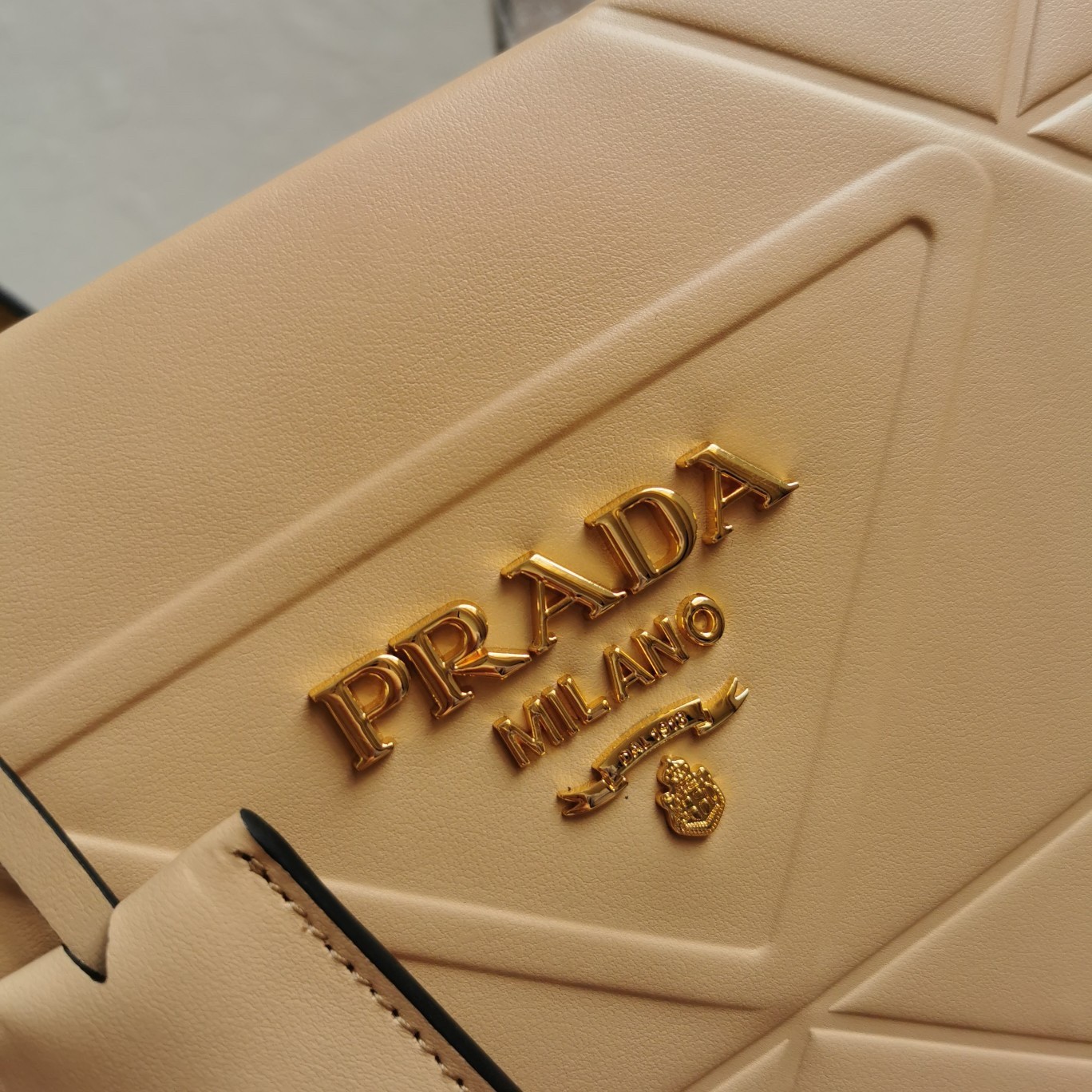 Prada Symbole Small Bag with Topstitching in Beige Leather