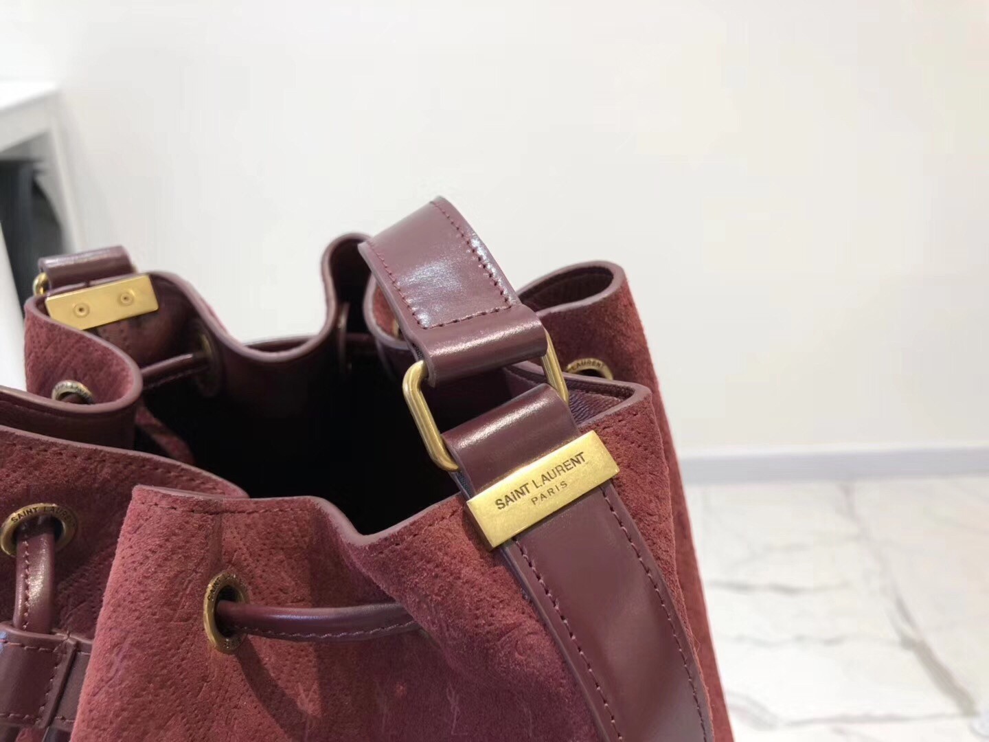 Saint Laurent Monogram All Over Bucket Bag In Bordeaux Suede