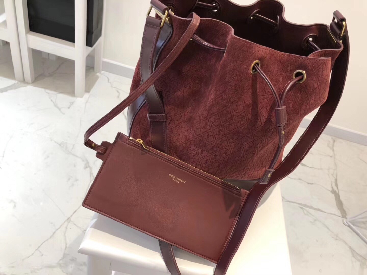 Saint Laurent Monogram All Over Bucket Bag In Bordeaux Suede