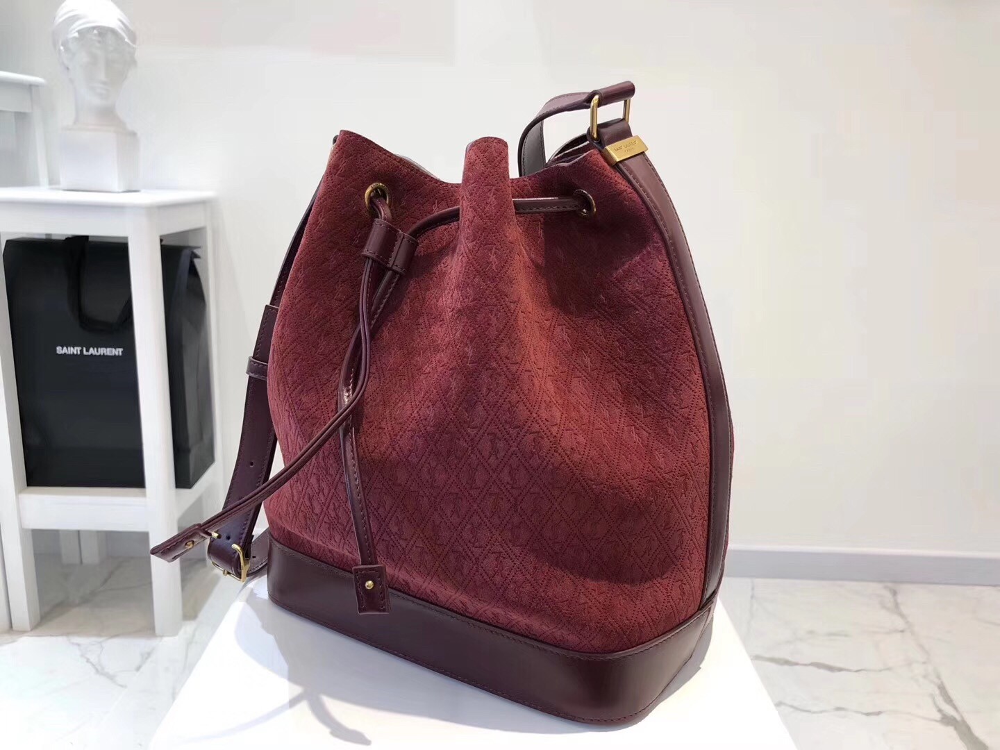 Saint Laurent Monogram All Over Bucket Bag In Bordeaux Suede