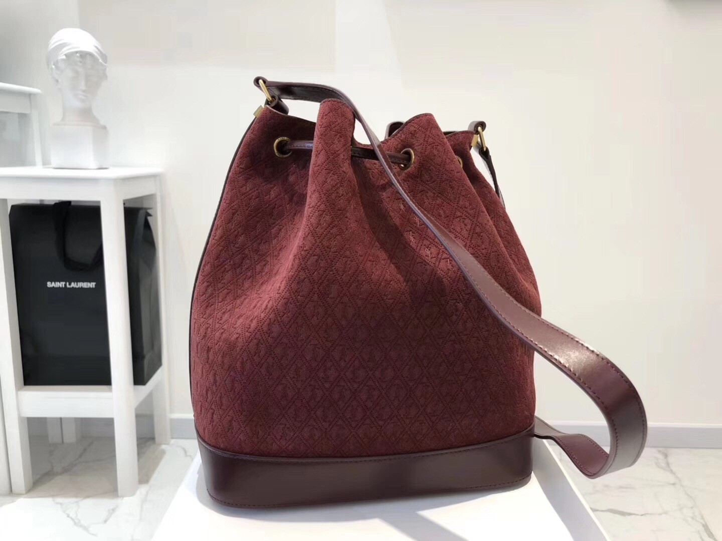 Saint Laurent Monogram All Over Bucket Bag In Bordeaux Suede