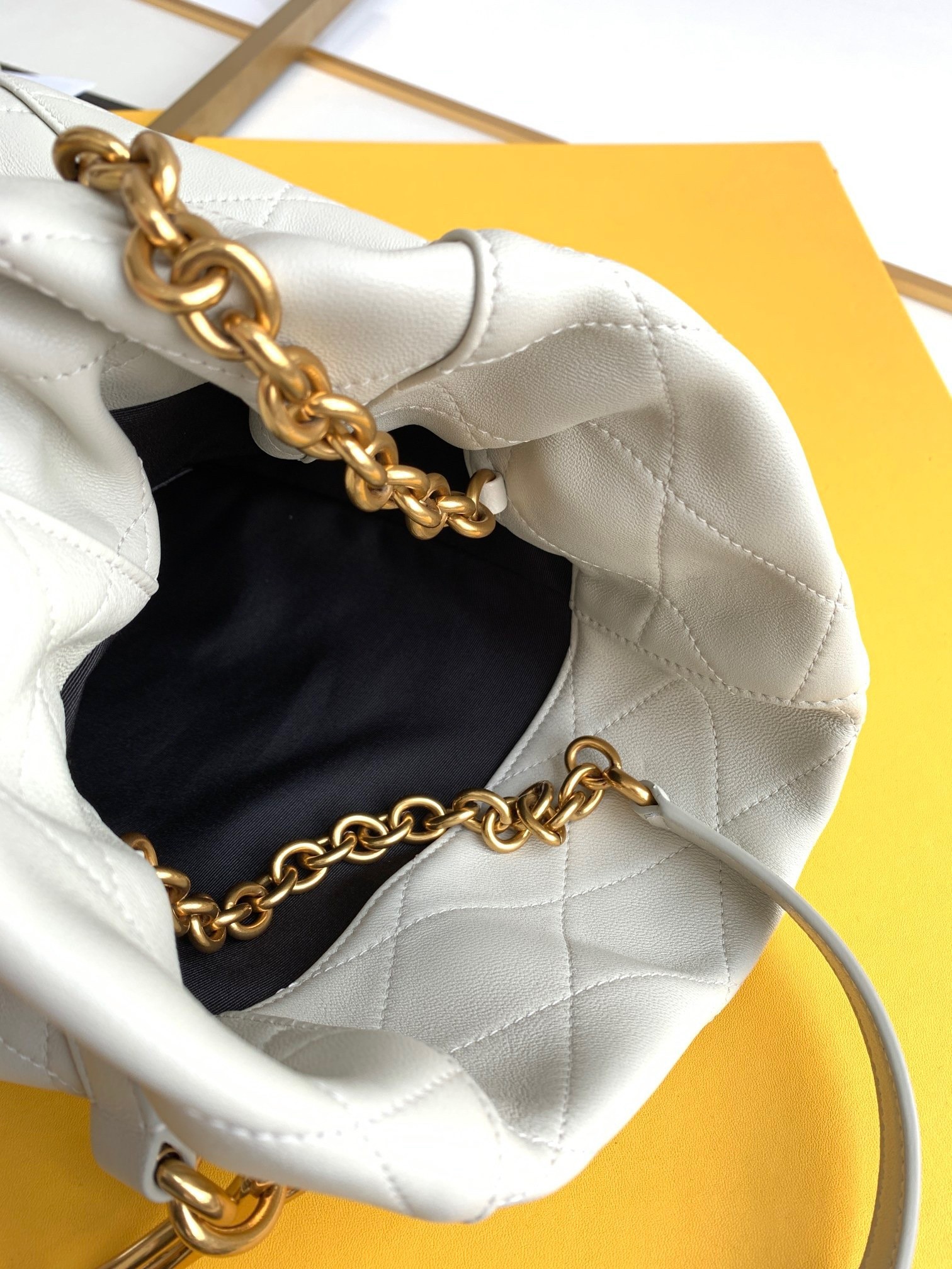 Saint Laurent Le Maillon Hook Bucket Bag In White Lambskin